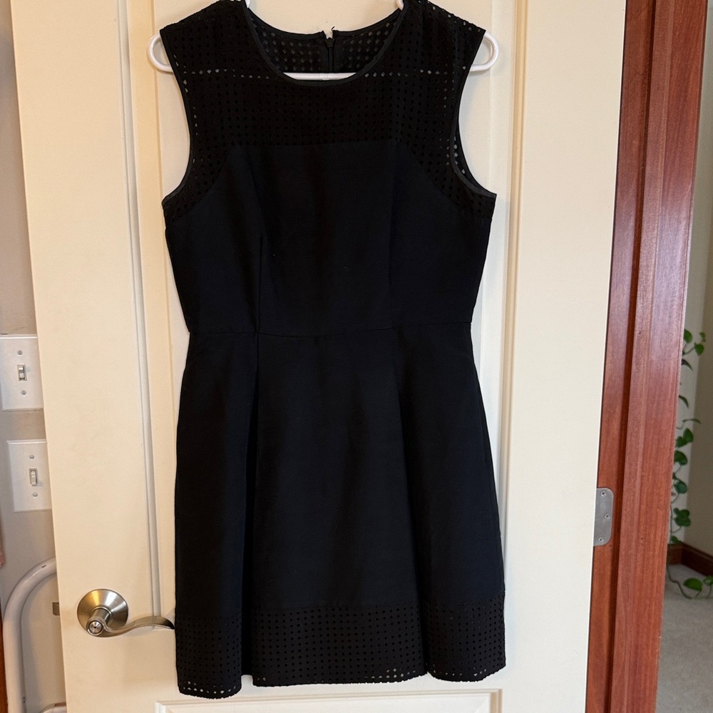 Elegant Black Sleeveless Dress with detailing